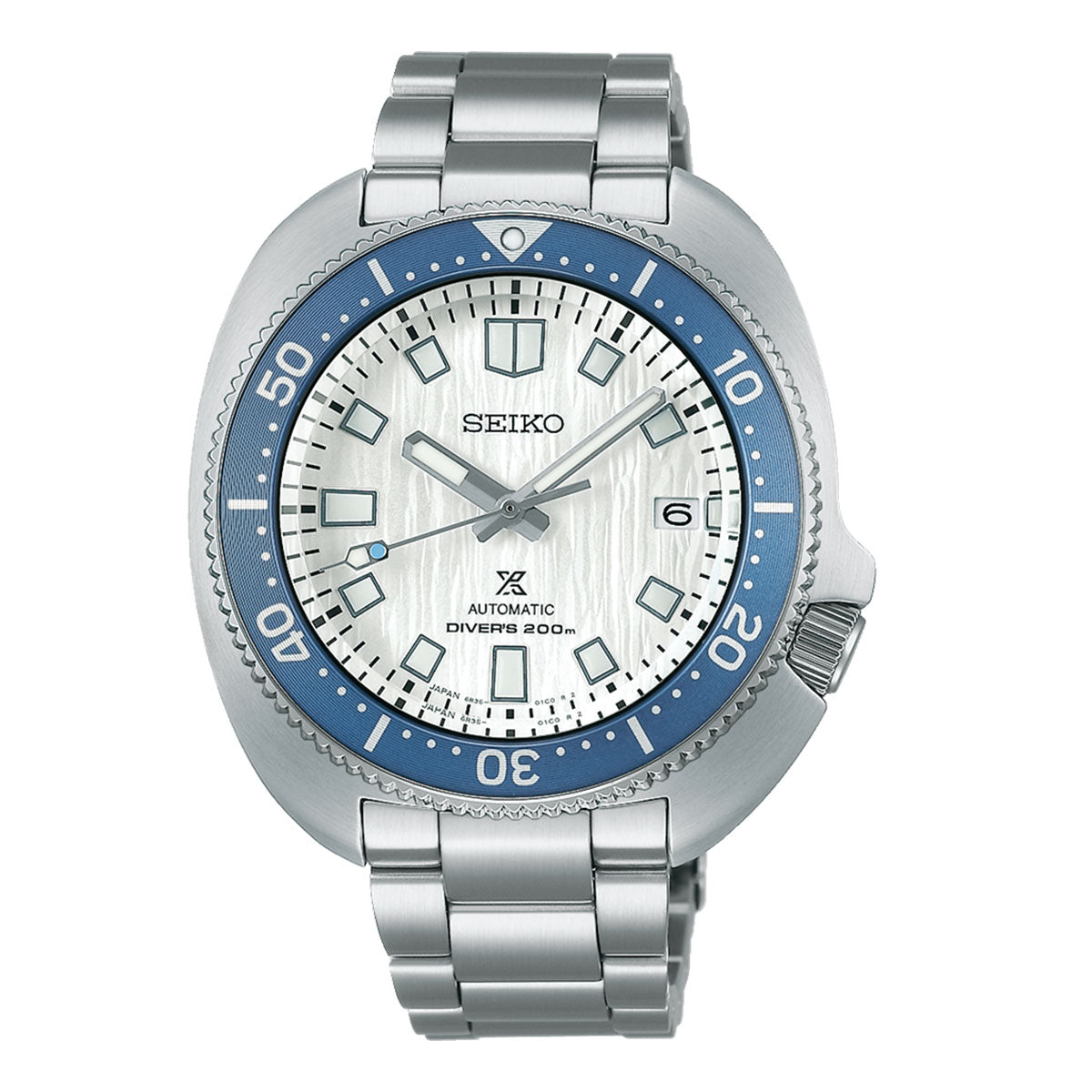 The Seiko Prospex Sea Save The Ocean Special Edition Automatic Watch features a striking white textured dial, complemented by a blue bezel and silver hour markers. It offers a date function at the 3 o'clock position. This elegant timepiece is equipped with a stainless steel bracelet and boasts water resistance up to 200 meters, highlighting Seiko's innovative craftsmanship.