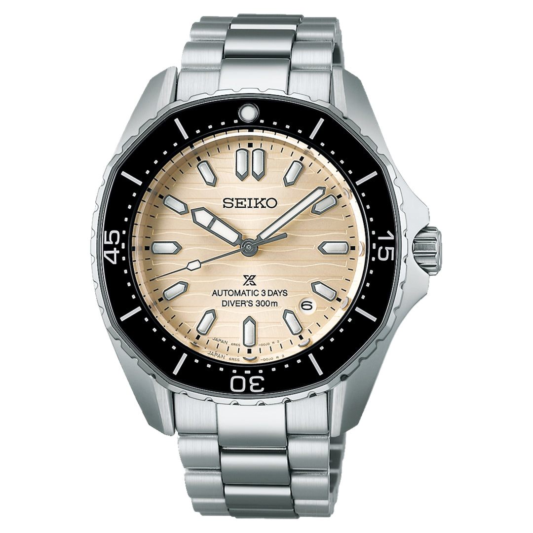 The Seiko Prospex Sea Automatic 41.3mm watch has a stainless steel band and beige textured dial, featuring luminous markers, a black bezel with minute markers, a date window at 3 o'clock, and "Automatic 3 Days Diver's 300m" on the dial for versatile design and superior water resistance.