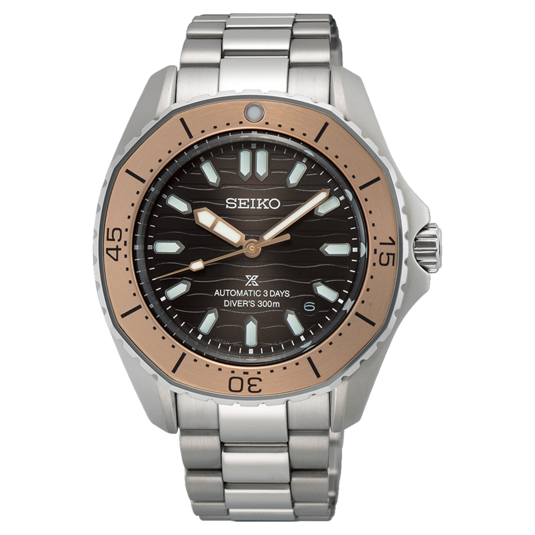 The Seiko Prospex Sea Automatic with Manual Winding 41.3mm watch features a silver case, black dial, Lumibrite-filled hands, rose gold-colored polygonal bezel, and stainless steel bracelet. It's labeled "Automatic 3 Days Diver's 300m" for superior water resistance.