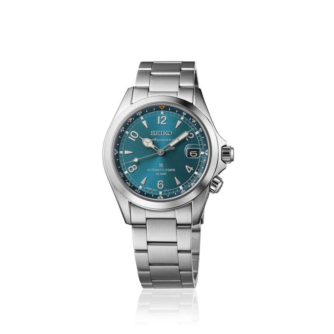 A Seiko Prospex Land Automatic With Manual Winding 39.5mm watch by Seiko, featuring a teal dial with silver hour markers and hands, a date display, and a stainless steel link bracelet, photographed against a plain white background.