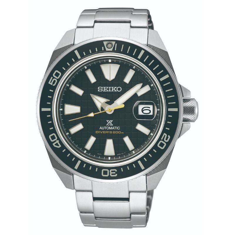 The Seiko Prospex Sea Automatic With Manual Winding 43.8mm Watch, in silver, is a must-have for adventure seekers. It features a black dial with white and silver hour markers and hands, along with a date window at 3 o'clock. The watch also includes an automatic movement indicator and a black bezel with silver numerals that enhance its sleek design.