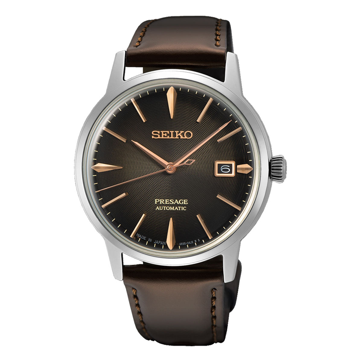 The Seiko Presage Automatic with Manual Winding 39.5mm Watch, from the renowned brand Seiko, captures Japanese aesthetics beautifully. It features a dark brown leather strap and a black sunburst dial adorned with gold hour markers, complemented by a 3 o’clock date window and a stainless steel case, showcasing exquisite mechanical watchmaking craftsmanship.