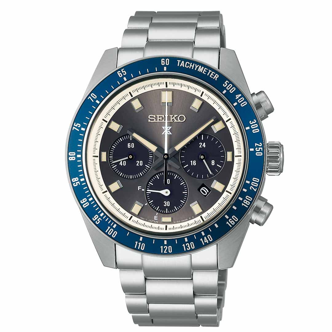 The Seiko Prospex Speedtimer Solar 41.4mm watch by Seiko showcases a striking silver design accentuated with a blue tachymeter bezel. It includes three subdials, a stainless steel link bracelet, and a dark dial embellished with white and silver markings, all driven by dependable solar movement.