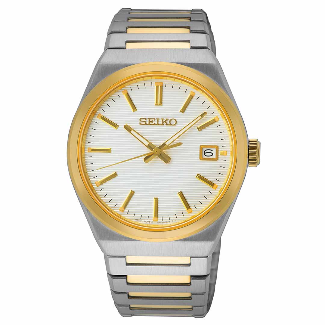 The Seiko Essentials Quartz 39mm Watch by Seiko boasts a sophisticated silver and gold-plated stainless steel band. Its round face displays a white textured dial adorned with gold hour markers and includes a date window at the 3 o'clock position, all protected by a sapphire crystal. The gold bezel perfectly complements the sleek metallic body and band.