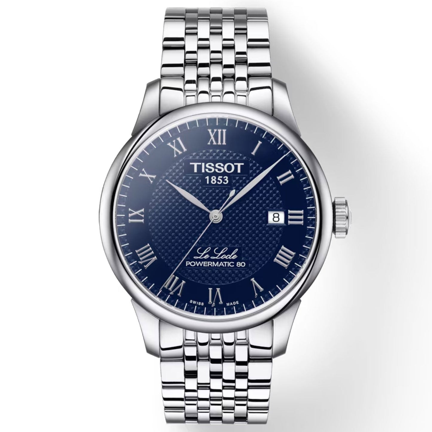 The Tissot Le Locle Powermatic 80 Automatic 39.3mm Watch features a stunning blue dial adorned with Roman numerals and a date window at the 3 o'clock position. Its silver stainless steel band and case are elegantly designed, complemented by a scratch-resistant sapphire crystal that showcases the watch's remarkable Powermatic 80 automatic movement.