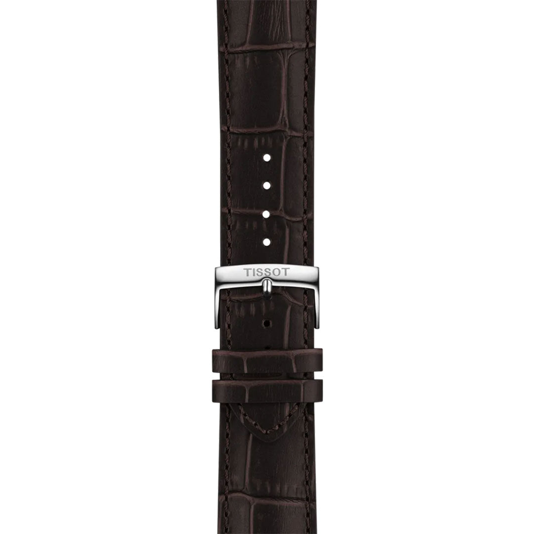 A dark brown leather strap with an alligator pattern for the Tissot CHRONO L Quartz 42mm Watch. It features a silver buckle engraved "TISSOT," Swiss technology, adjustable holes, and dual loops to secure the end.