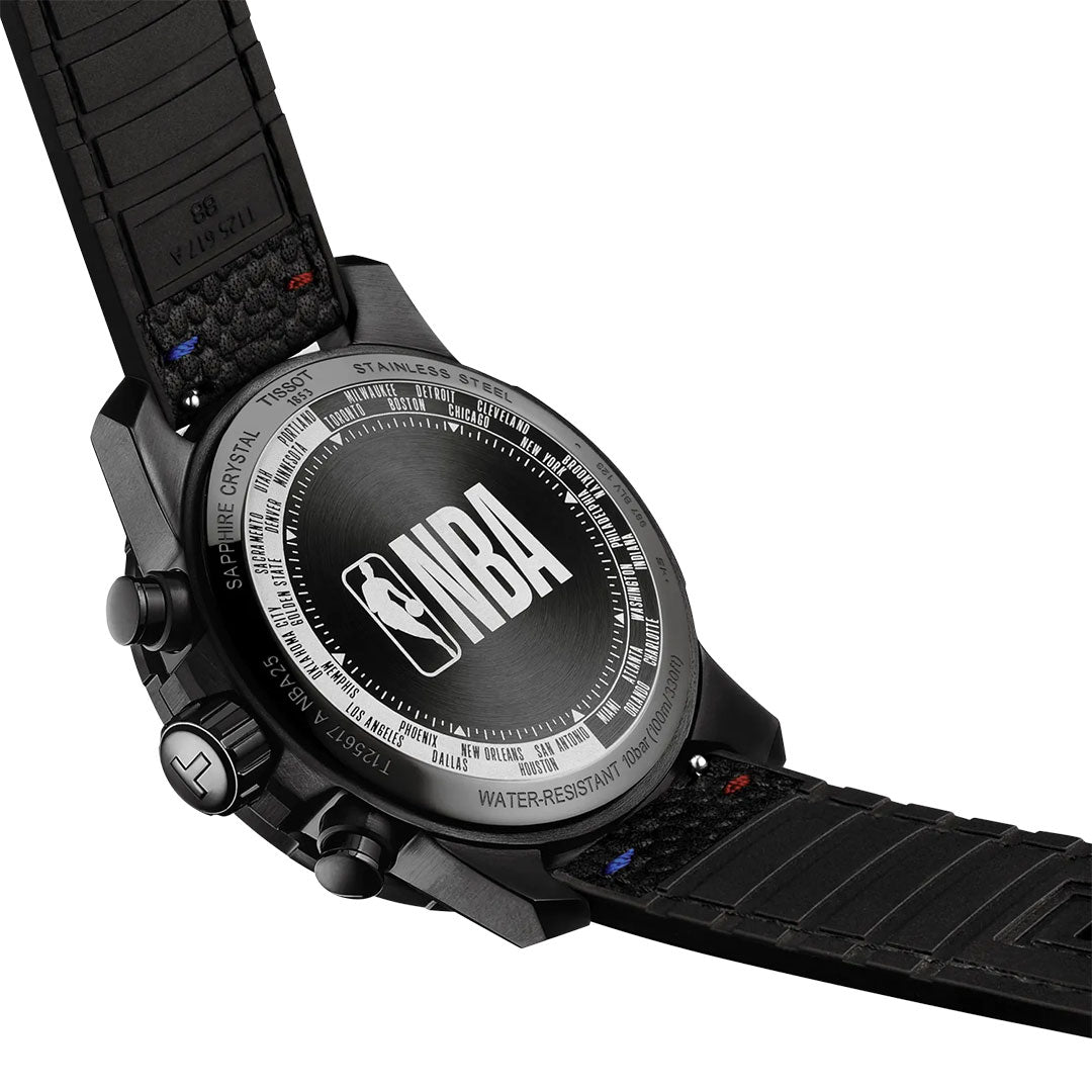 Close-up of the Tissot Supersport NBA Special Edition Quartz 45.5mm Watch, showing "NBA" and the NBA logo engraved on the black PVD stainless steel case, with a black strap and visible side control buttons.