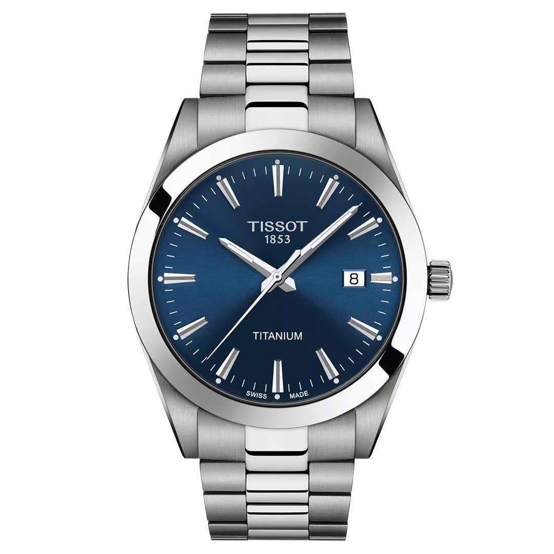 The Tissot Gentleman Titanium Quartz 40mm Watch features a metallic strap, blue dial, silver markers and hands, a date at 3 o'clock, and "TISSOT 1853" and "TITANIUM" on the face. Swiss Quartz movement ensures precision.
