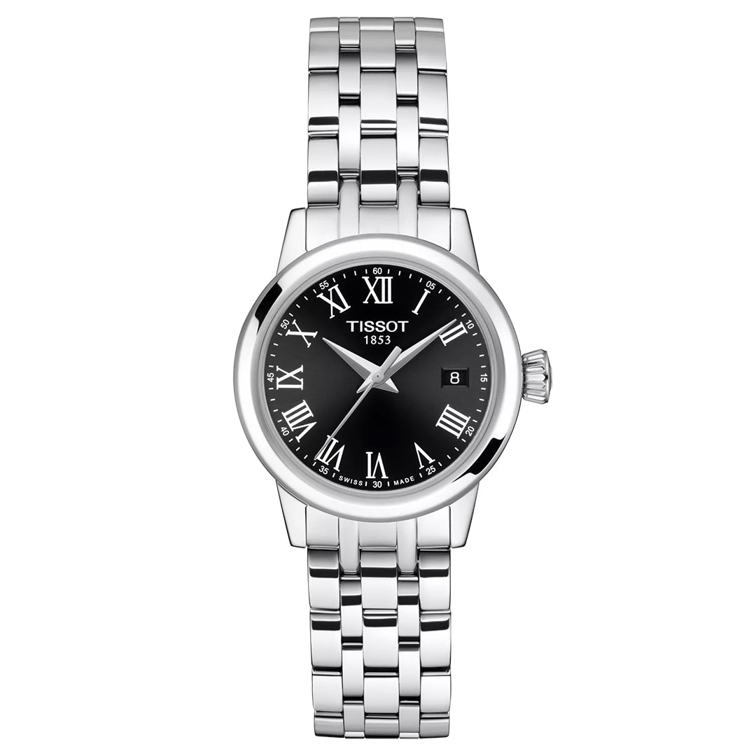 The Tissot Classic Dream Lady Quartz 28mm Watch features a silver-tone metal link band, black dial with white Roman numerals, Swiss Quartz movement, and a date display at 3 o’clock.