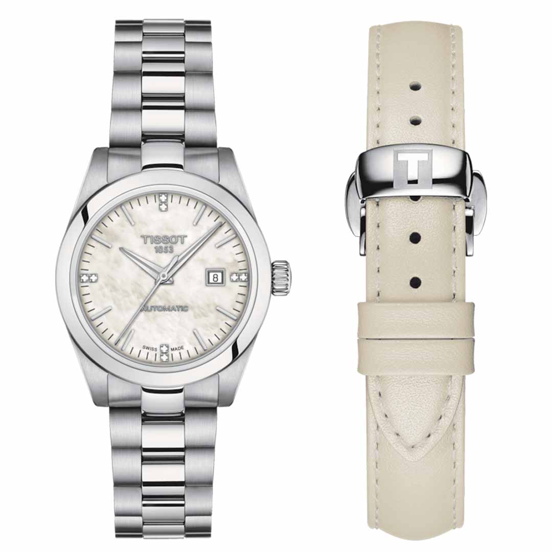 The Tissot T-My Lady Automatic 29mm Watch showcases a luxurious mother-of-pearl dial protected by a durable sapphire crystal, elegantly displaying the date. Its silver case is complemented by a metal link bracelet, and it comes with an additional cream-colored leather strap embossed with the letter "T," secured by a silver clasp.