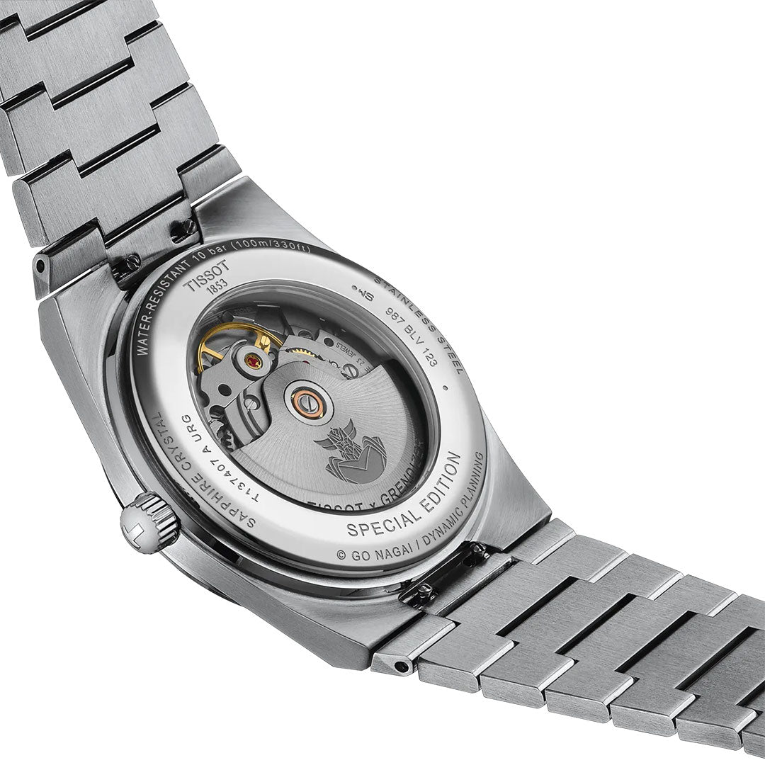 Close-up of the Tissot PRX UFO Robot Grendizer Powermatic 80 Automatic 40mm Watch, displaying its transparent caseback, detailed mechanical movement, engraved text, and "SPECIAL EDITION" marking on the rim.