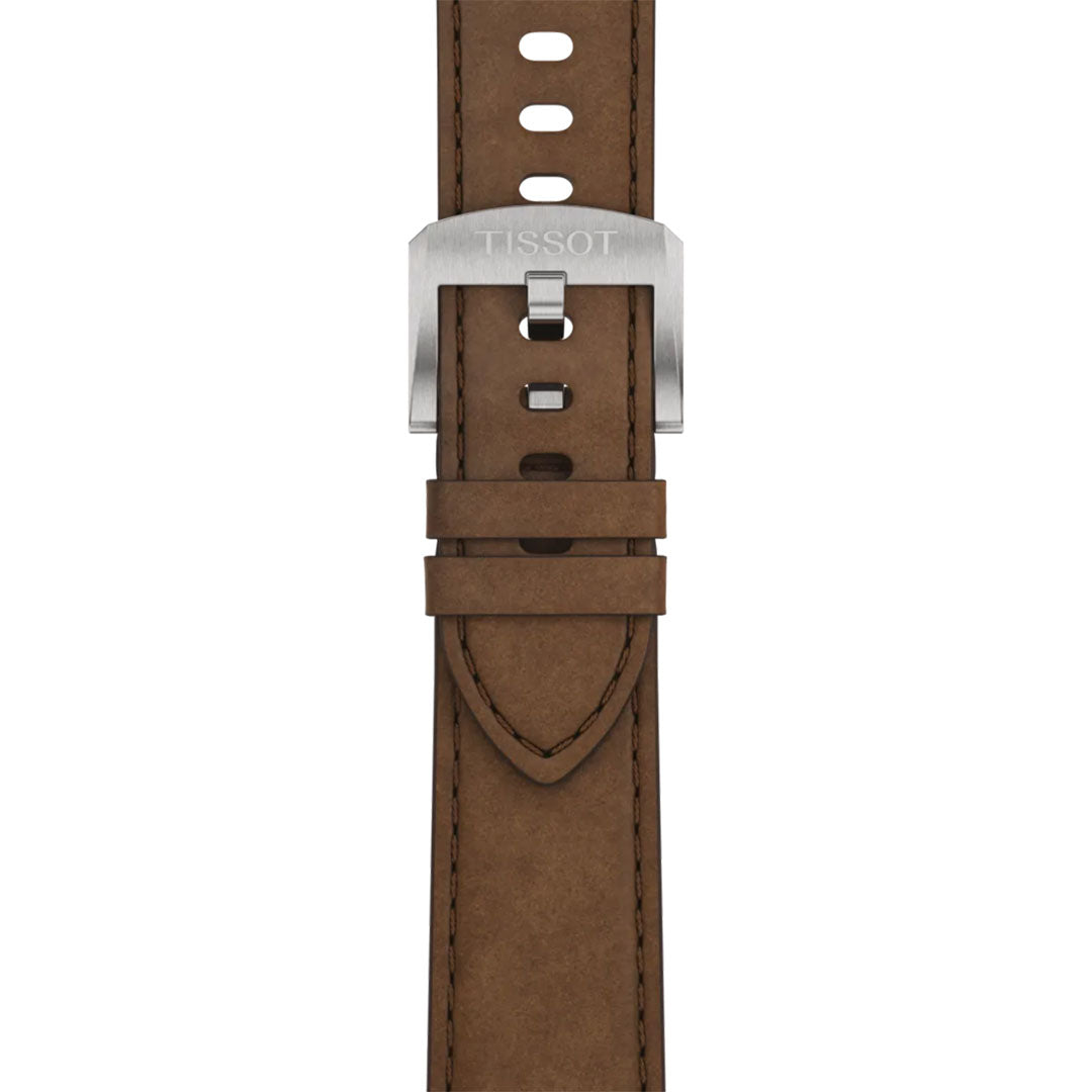 Close-up of a brown leather strap with a silver buckle engraved "Tissot," designed for the Tissot PRC 100 Solar Quartz 39mm Watch. The strap features visible stitching and multiple adjustment holes.