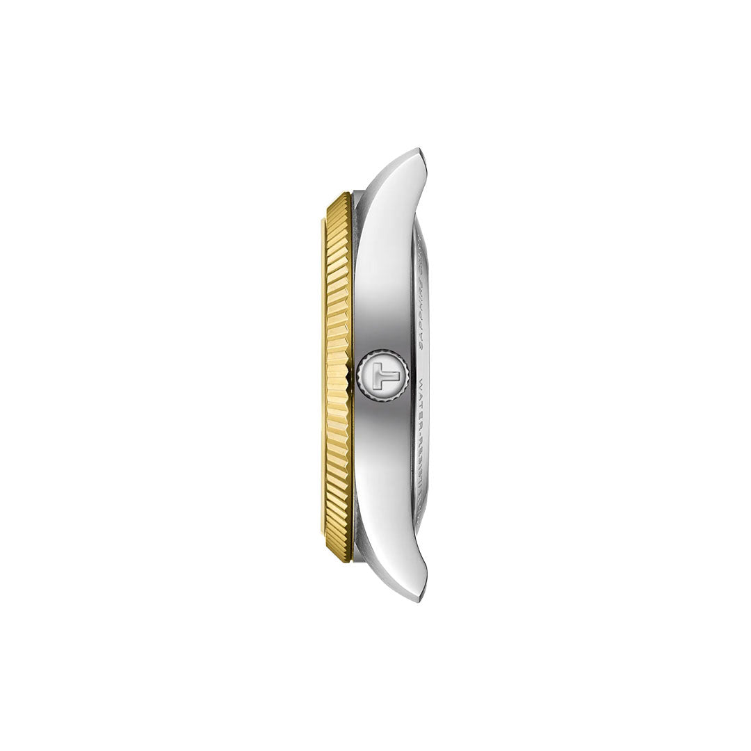 Side view of the Tissot Ballade Powermatic 80 Automatic 39mm shows a two-tone case with a silver body, gold ridged bezel, and logo crown—this Tissot watch is chronometer-certified. Watch face and strap are not visible.