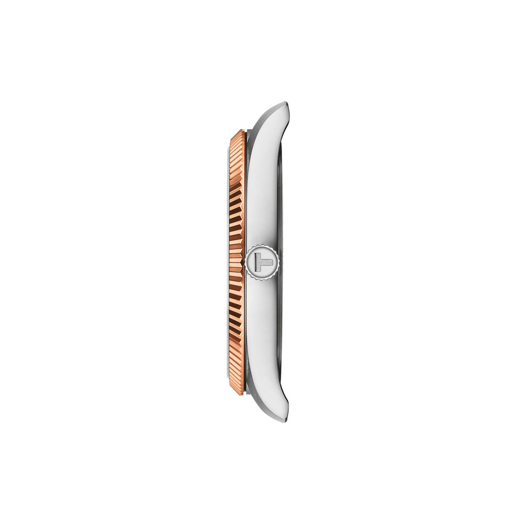 Side view of the Tissot Ballade Quartz 40mm Watch by Tissot, displaying a two-tone silver case with a rose gold fluted bezel and a crown embossed with the brand logo, all set against a plain white background.