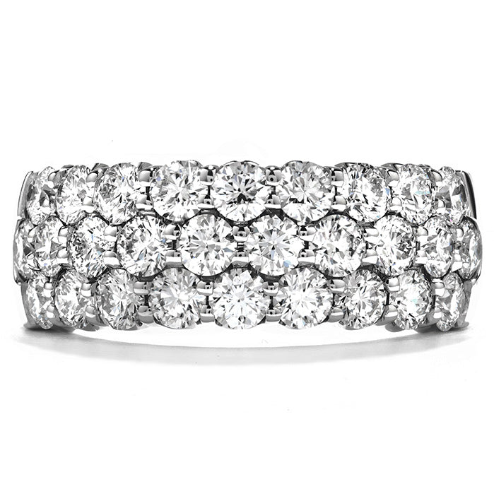 Discover the sophistication of the Hearts On Fire Truly 18K White Gold Round Brilliant Diamond Triple Row Fashion Ring. This exquisite piece from Hearts on Fire is adorned with multiple rows of sparkling diamonds, showcasing SI-VS clarity, adding a refined touch to any jewelry collection.