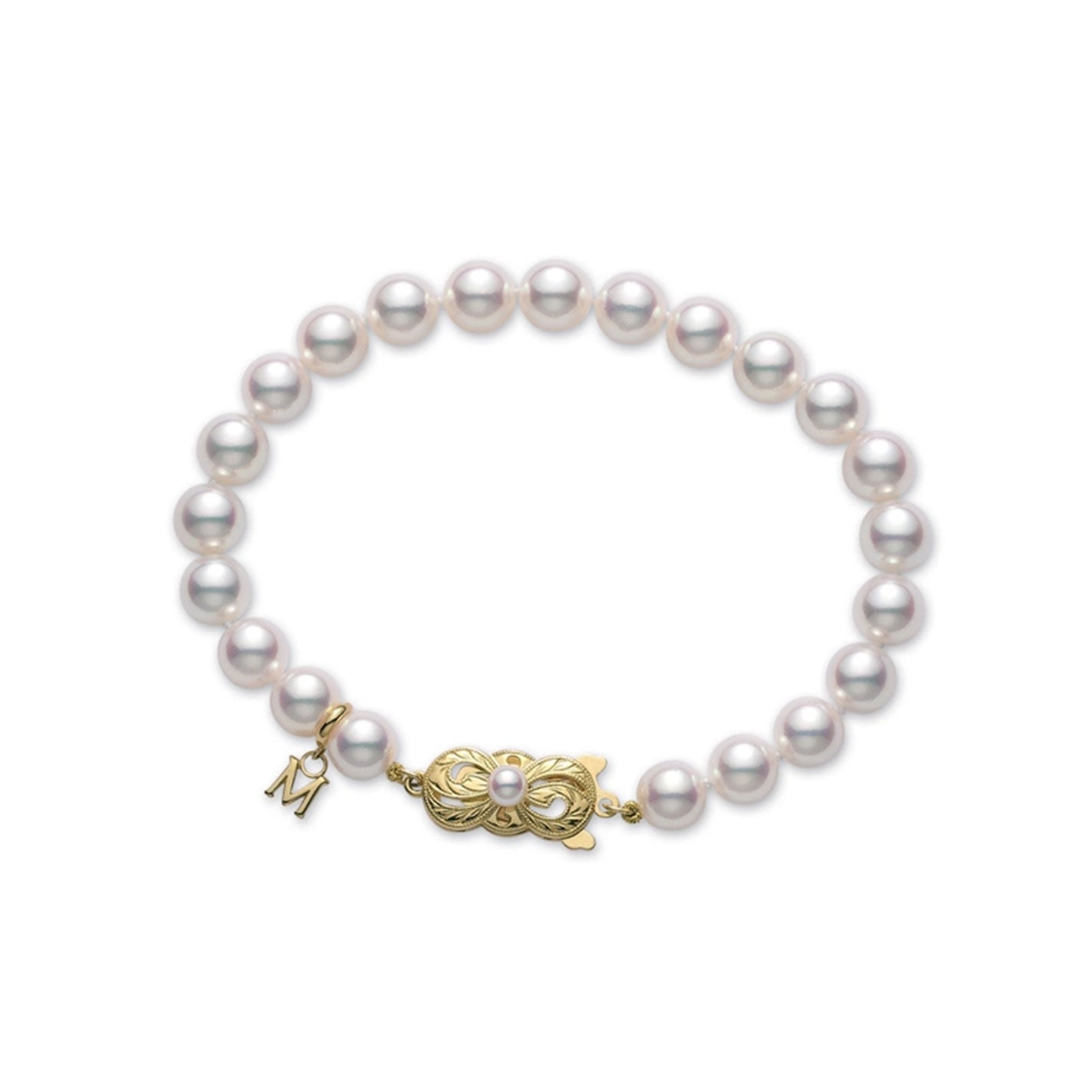 The Mikimoto Akoya Cultured Pearl Strand Bracelet with an 18K Yellow Gold Clasp features exquisite round Akoya cultured pearls and a decorative clasp. A small gold charm adorned with the letter "M," typical of Mikimoto's design, elegantly complements the clasp, enhancing its sophisticated appearance.