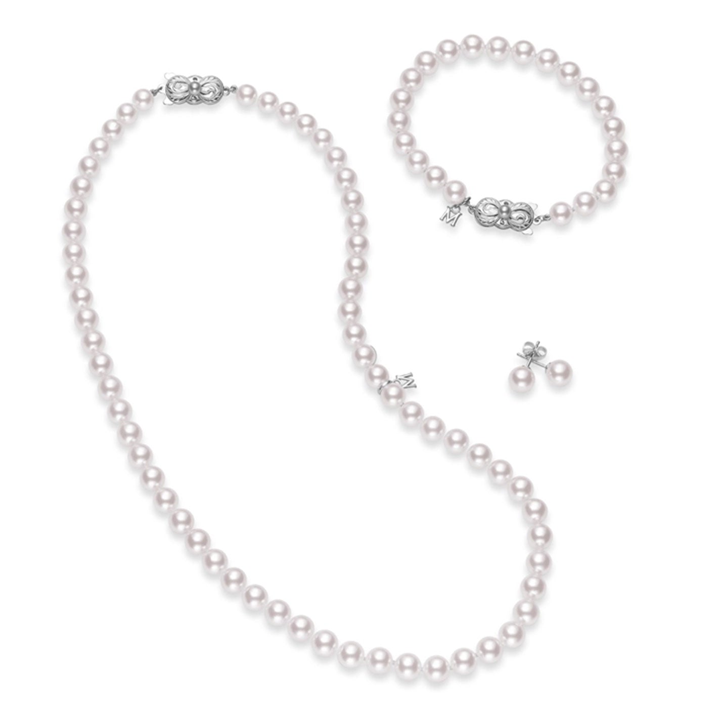 The Mikimoto Three-Piece Set includes a necklace, bracelet, and stud earrings, each beautifully crafted with round Akoya cultured pearls. The necklace and bracelet feature secure Mikimoto clasps in 18K white gold.
