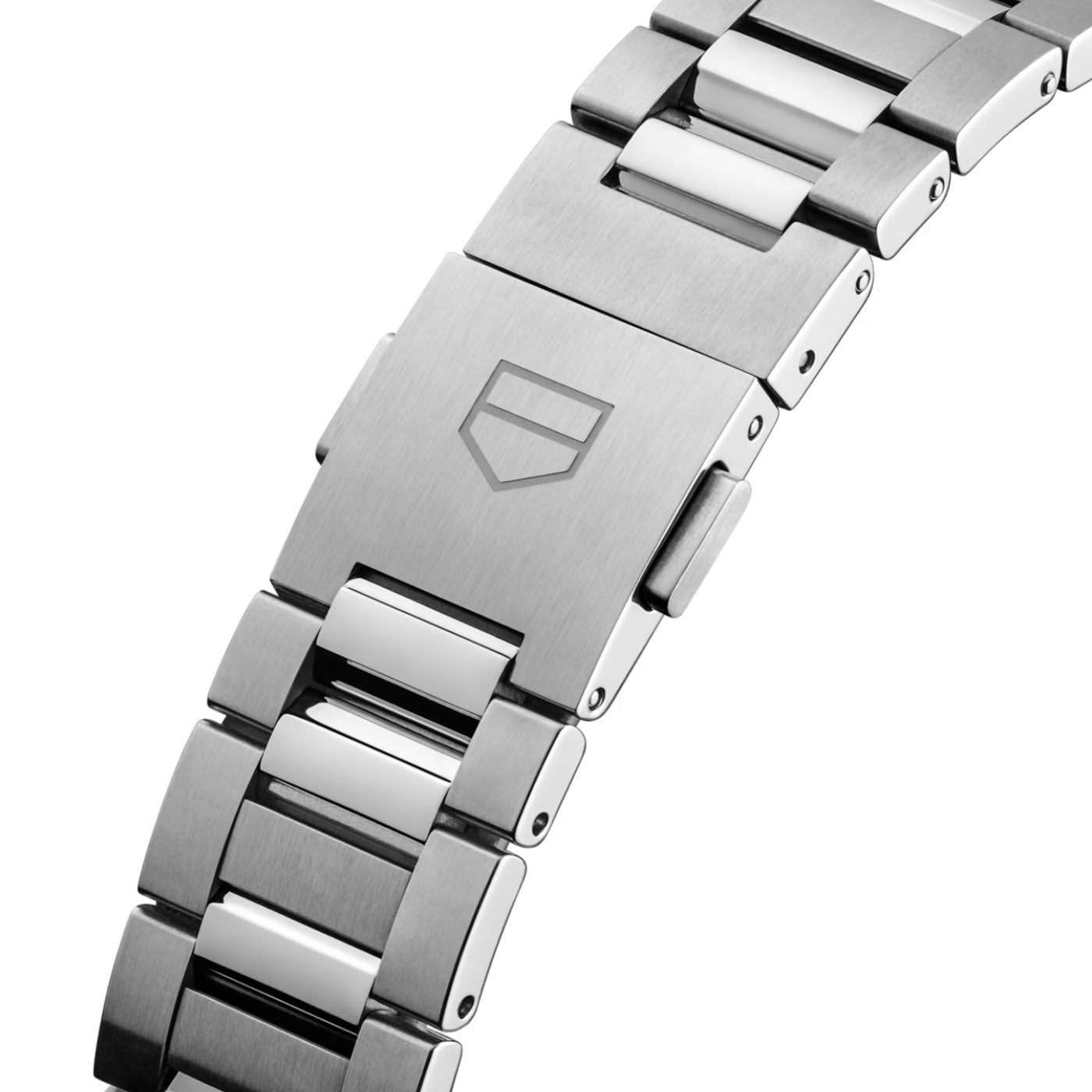 Close-up of the TAG Heuer Carrera Date Automatic 36mm watch bracelet in silver metal, featuring a clasp engraved with the signature shield logo. The stainless steel bracelet combines brushed and polished links, presenting a modern, sleek look that perfectly complements the striking pink dial of this TAG Heuer timepiece.