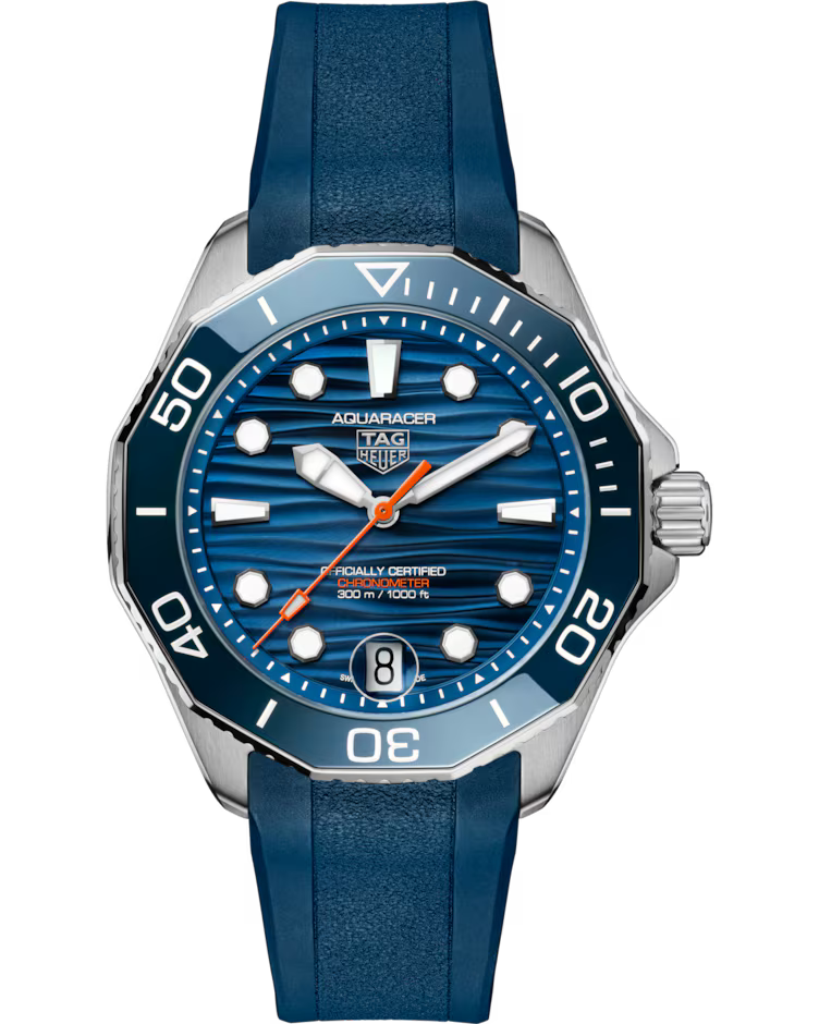 The TAG Heuer Aquaracer Professional 300 Date Automatic 42mm Watch features a striking blue striped dial complemented by silver hour markers, a blue bezel, and a matching blue rubber strap. It includes a date window at the 6 o’clock position and is water resistant up to 300 meters.