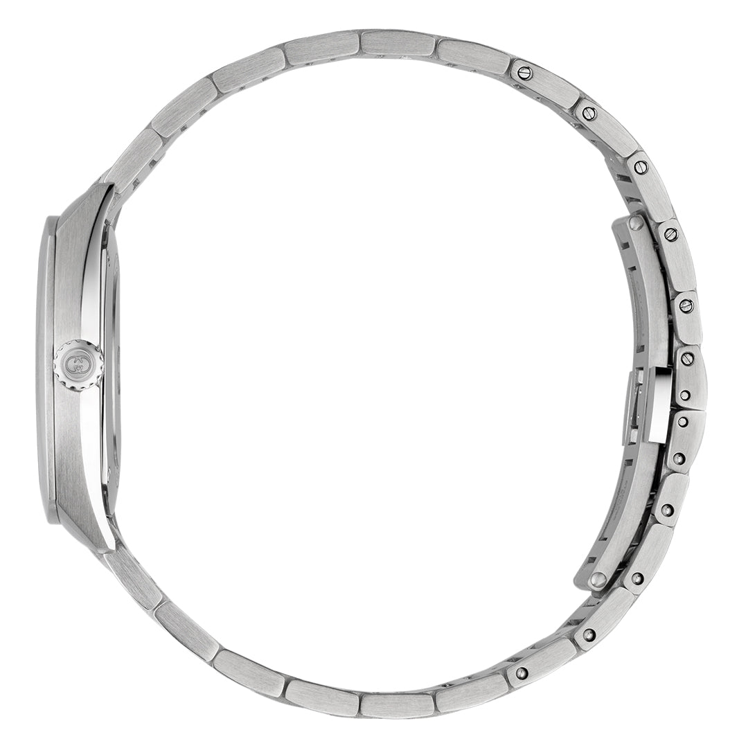 A side view of the Gucci Interlocking Quartz 29mm Watch highlights its sleek, modern design with a stainless steel case, metallic strap, closed clasp, visible left crown, and detailed links. The watch's thin profile is accentuated against a plain white background.