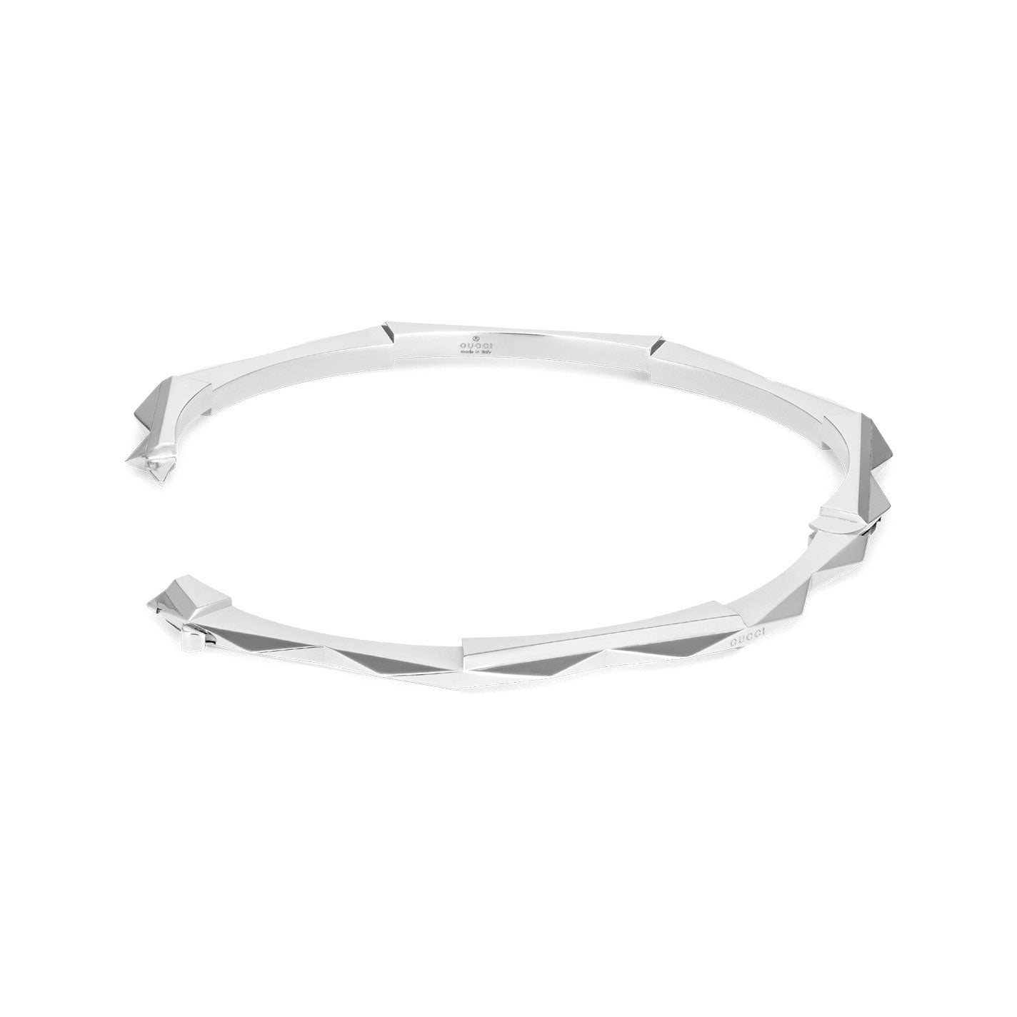 The Gucci Link to Love 18K White Gold Studded Bangle by GUCCI Fine Jewellery is a chic, geometric bracelet designed with angular facets and a minimalist aesthetic. Showcased against a pristine white background, this exquisite piece embodies the timeless elegance associated with Gucci.