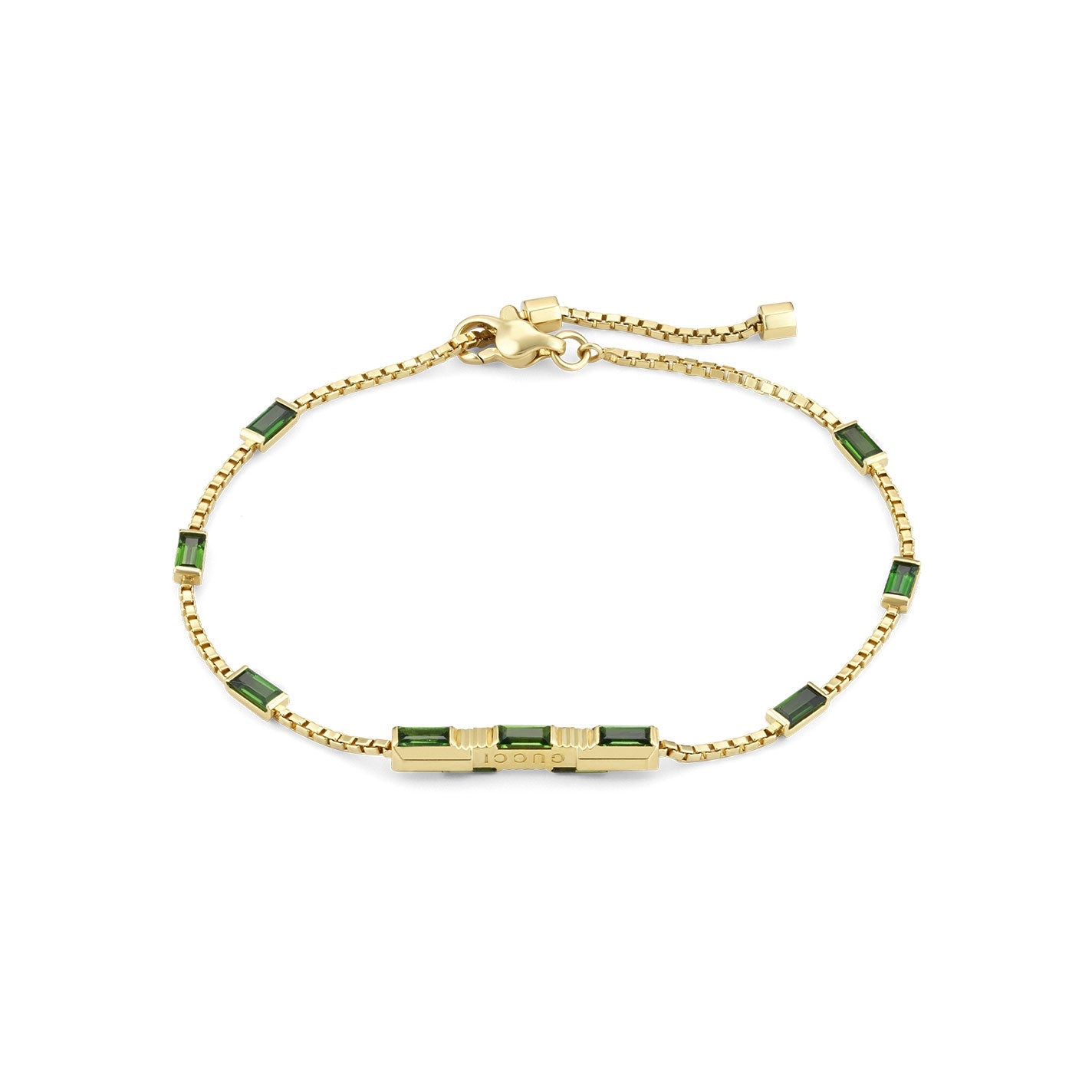 The Gucci Link to Love 18 Karat Yellow Gold Tourmaline Station Bracelet by GUCCI Fine Jewellery is a breathtaking piece featuring green tourmaline rectangular gem accents. It boasts a chain link design and an adjustable clasp for the perfect fit.