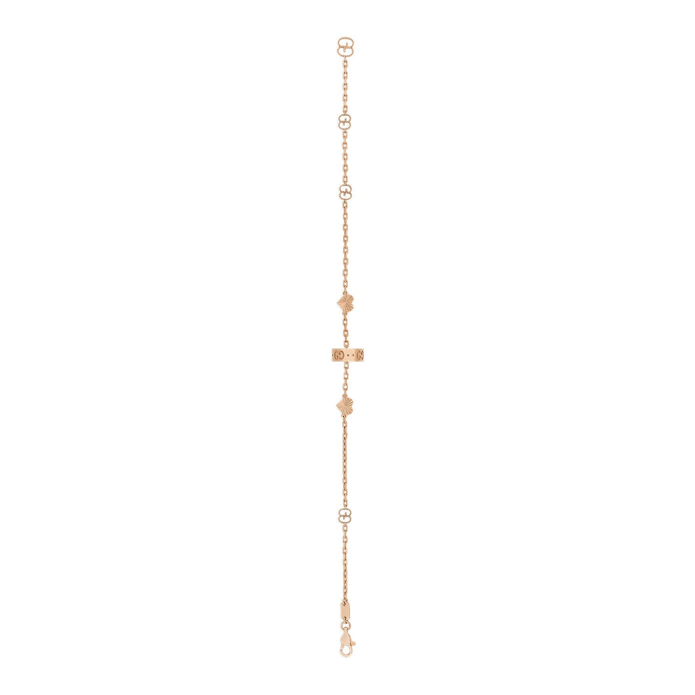 The Gucci Icon Heart 18K Rose Gold Station Bracelet by GUCCI Fine Jewellery is a delicate piece adorned with an assortment of small floral and geometric charms that are evenly distributed along its fine chain, secured by a clasp closure.