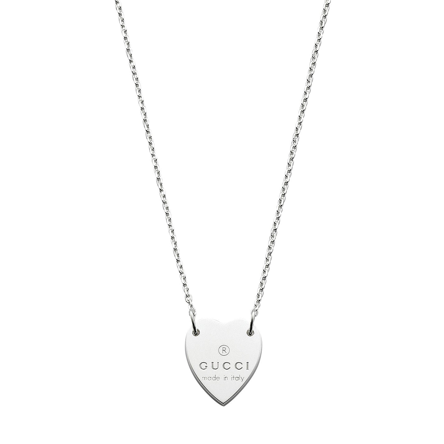 The Gucci Trademark Heart Sterling Silver Chain Necklace Pendant from GUCCI Fine Jewellery showcases a heart-shaped pendant engraved with "Gucci made in Italy." The pendant gracefully hangs from a slender, delicate chain, accentuating the renowned Gucci trademark.