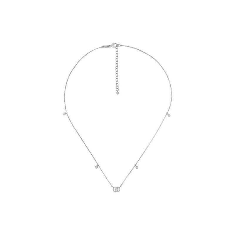 Introducing the Gucci GG Running 18K White Gold Diamond Necklace Pendant by GUCCI Fine Jewellery. This exquisite piece features a central circular pendant crafted from 18K white gold and adorned with diamonds. Its adjustable chain includes tiny bead-like ornaments evenly spaced, adding a touch of elegance to this delicately designed necklace.
