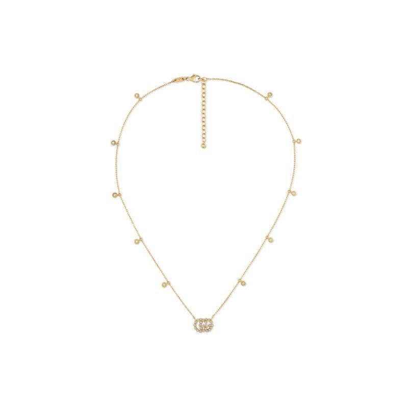 This exquisite Gucci GG Running necklace, crafted from 18K Yellow Gold by GUCCI Fine Jewellery, showcases small round beads and an interlocking circular pendant at the center. Adorned with sparkling diamonds, this elegant piece exudes sophistication, making it a timeless addition to any jewelry collection.