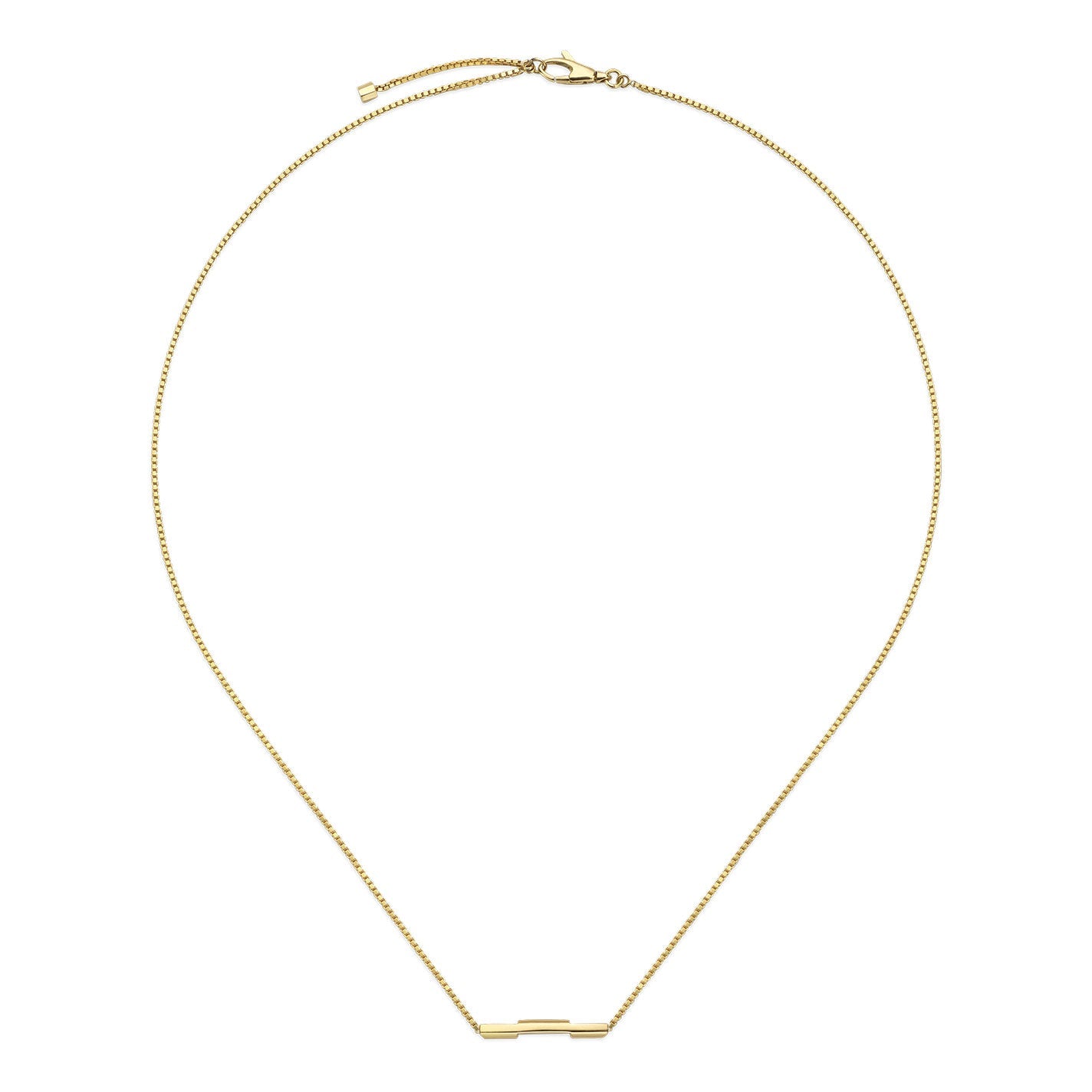 The Gucci Link to Love 18K Yellow Gold Necklace with a "Gucci" bar pendant by GUCCI Fine Jewellery is elegantly displayed against a plain white background. This delicate chain necklace features a small rectangular bar pendant at the center, complete with a simple clasp closure, highlighting its timeless appeal and elegant simplicity.