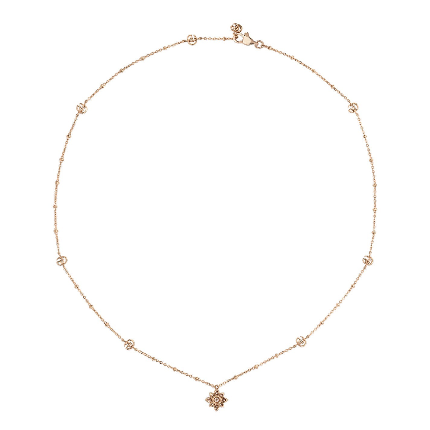 The Gucci Flora 18K Rosé Gold Diamond Station Necklace Pendant by GUCCI Fine Jewellery is an exquisite piece featuring small circular accents along the chain and a central pendant shaped like a star or floral motif. Its subtle diamond embellishments provide an elegant sparkle, with the clasp positioned at the top.