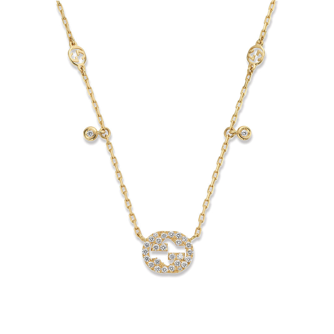 The Gucci Interlocking G 18K Yellow Gold Diamond Station Necklace Pendant from GUCCI Fine Jewellery showcases small circular accents and a diamond-encrusted Interlocking G pendant for elegant sparkle.