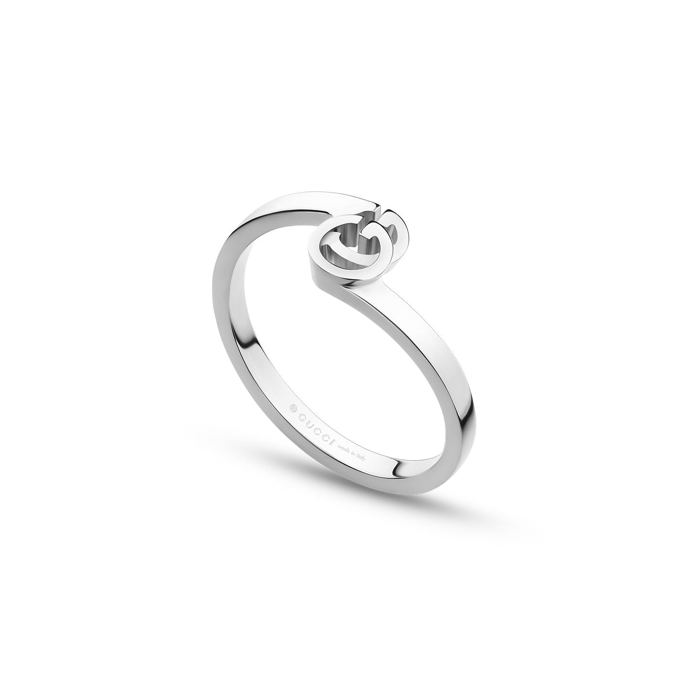 The Gucci Running G 18K White Gold Ring from GUCCI Fine Jewellery presents a sleek and minimalist design, highlighted by an intertwined "G" detail symbolizing the brand logo atop its polished silver surface. The ring features subtle branding engraved on the inner band.