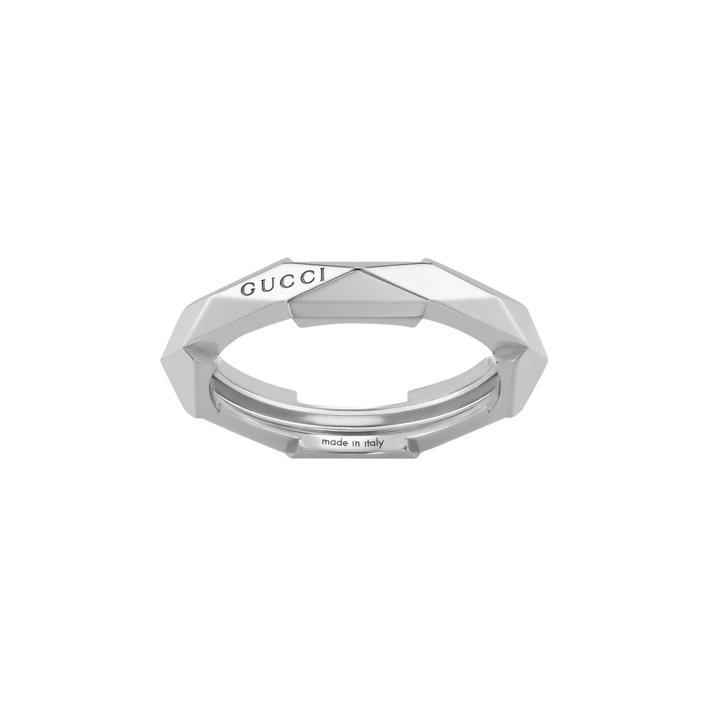 This 18k white gold ring from the GUCCI Fine Jewellery collection, known as the Gucci Link to Love Studded 18K White Gold Ring, features a geometric faceted design with "GUCCI" engraved on top and "made in Italy" on the inside. Its stackable characteristic embodies timeless elegance and modern sophistication.