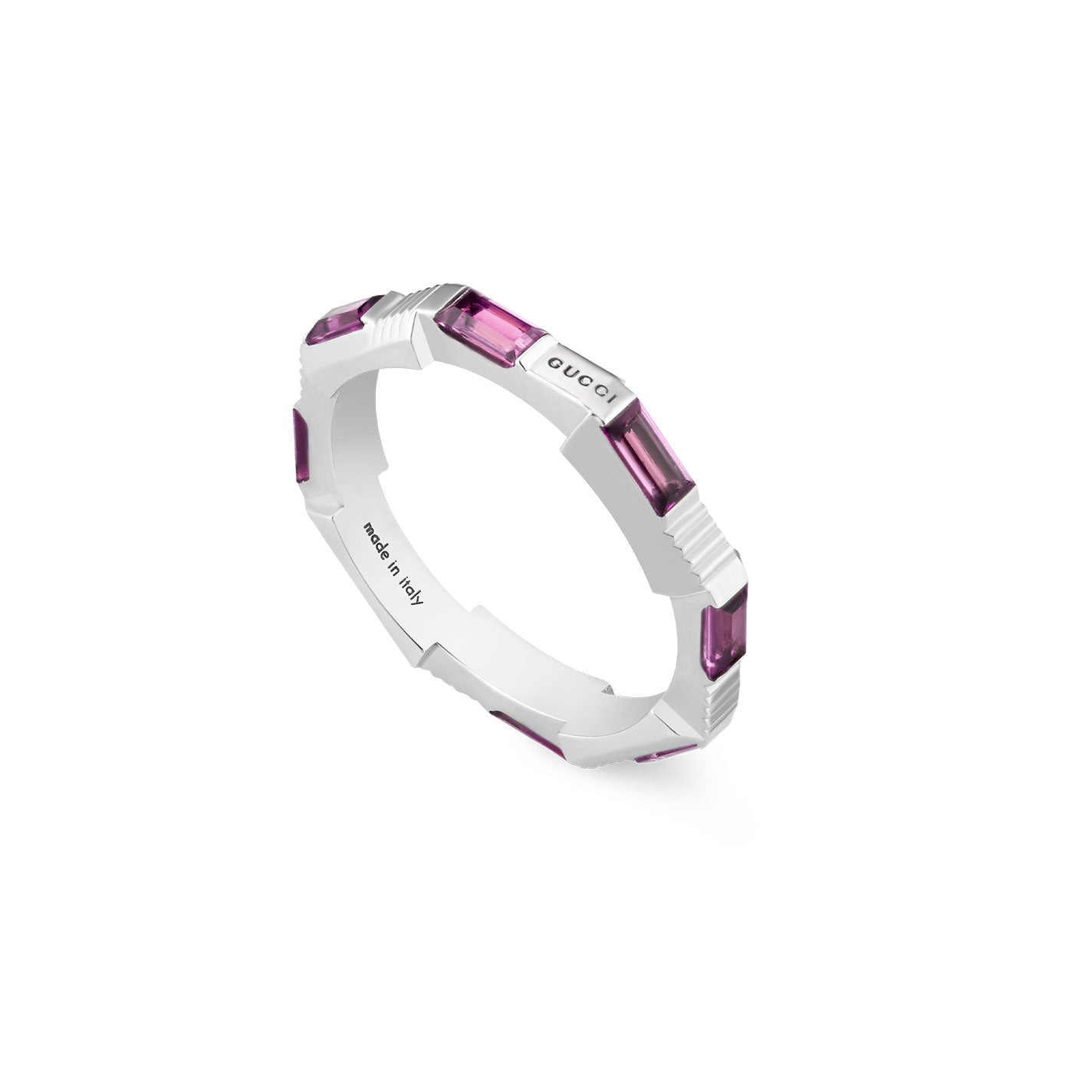 The Gucci Link to Love Rubellite 18K White Gold Ring from GUCCI Fine Jewellery features a striking design with sophisticated rectangular rubellite stones gracefully spaced along the band. One section of the ring bears the "Gucci" engraving, while "made in Italy" is inscribed inside, confirming its exceptional craftsmanship.