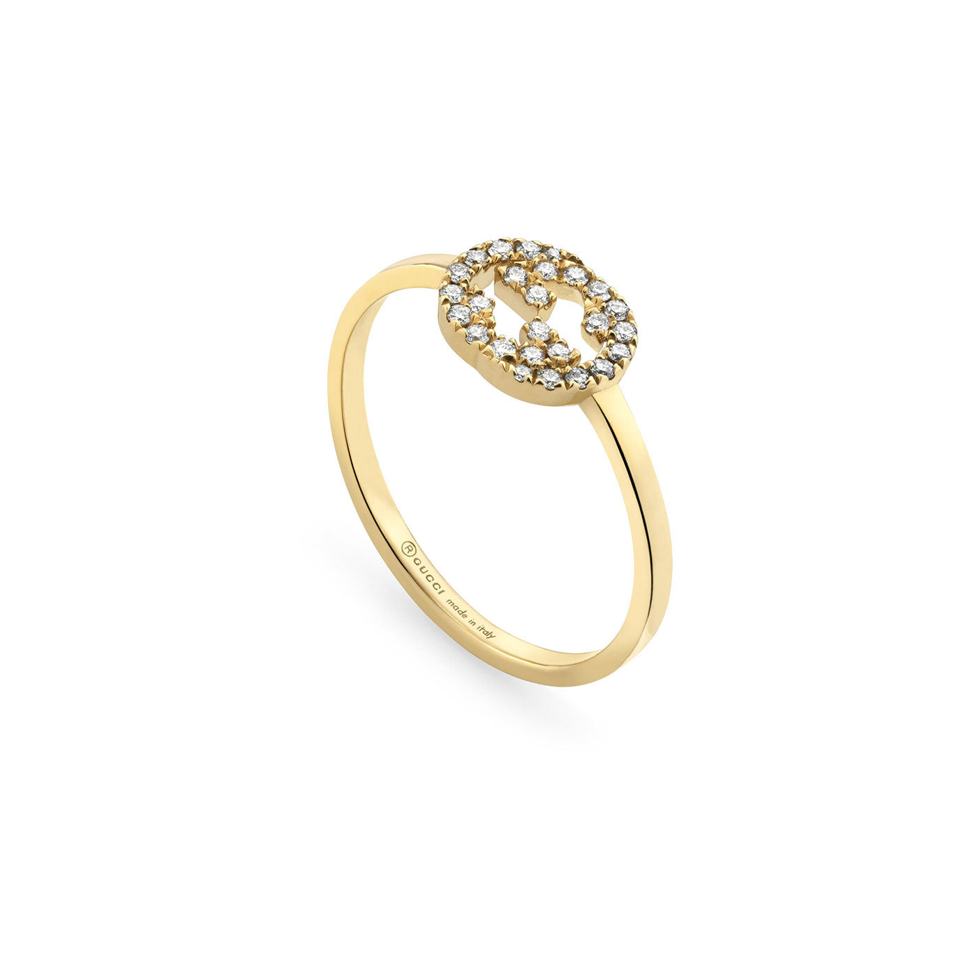 The Gucci Interlocking G 18K Yellow Gold Diamond Ring from GUCCI Fine Jewellery showcases a circular emblem adorned with diamonds, featuring the renowned interlocking G logo. The band is slender and sophisticated, highlighting the detailed craftsmanship of the emblem, with discreet branding visible on the inside.