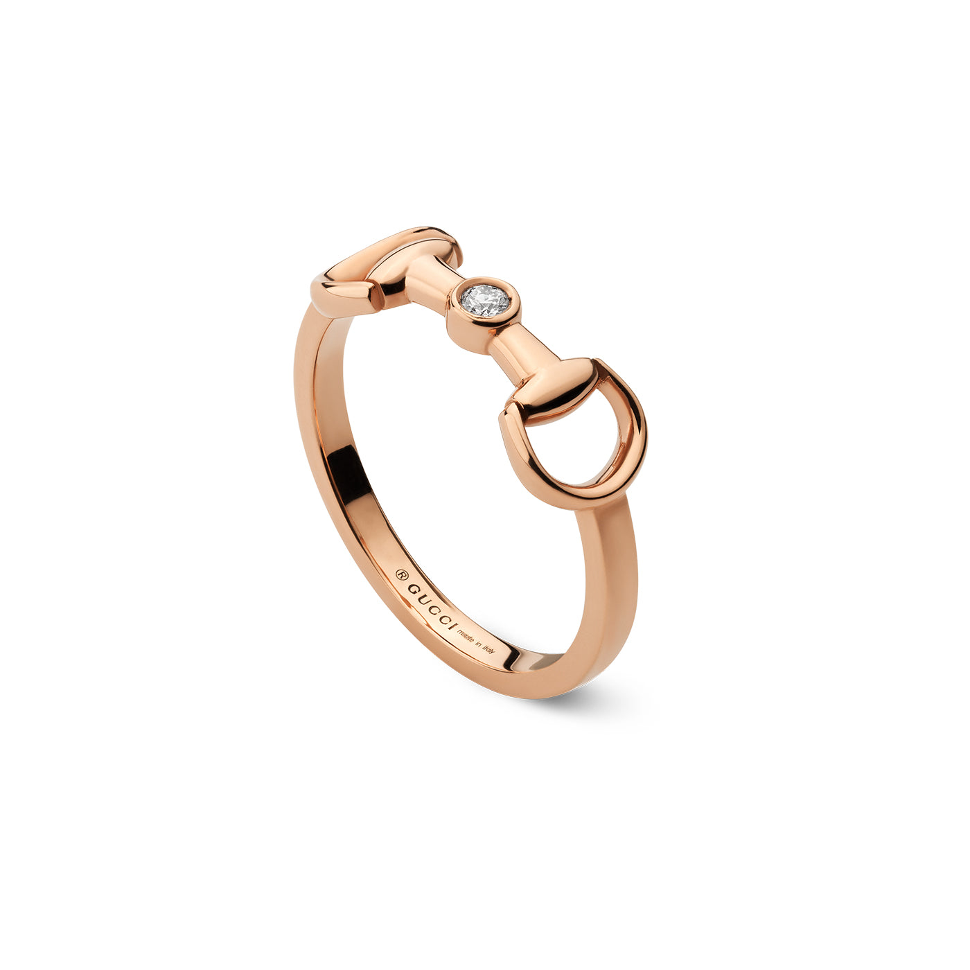 The Gucci Horsebit 18K Rose Gold Diamond Ring, part of the GUCCI Fine Jewellery collection, showcases a unique horsebit design crafted in 18k rose gold. A round diamond is elegantly set at the center, while the inside of the band is engraved with the brand logo, epitomizing the sophistication of Horsebit jewelry.