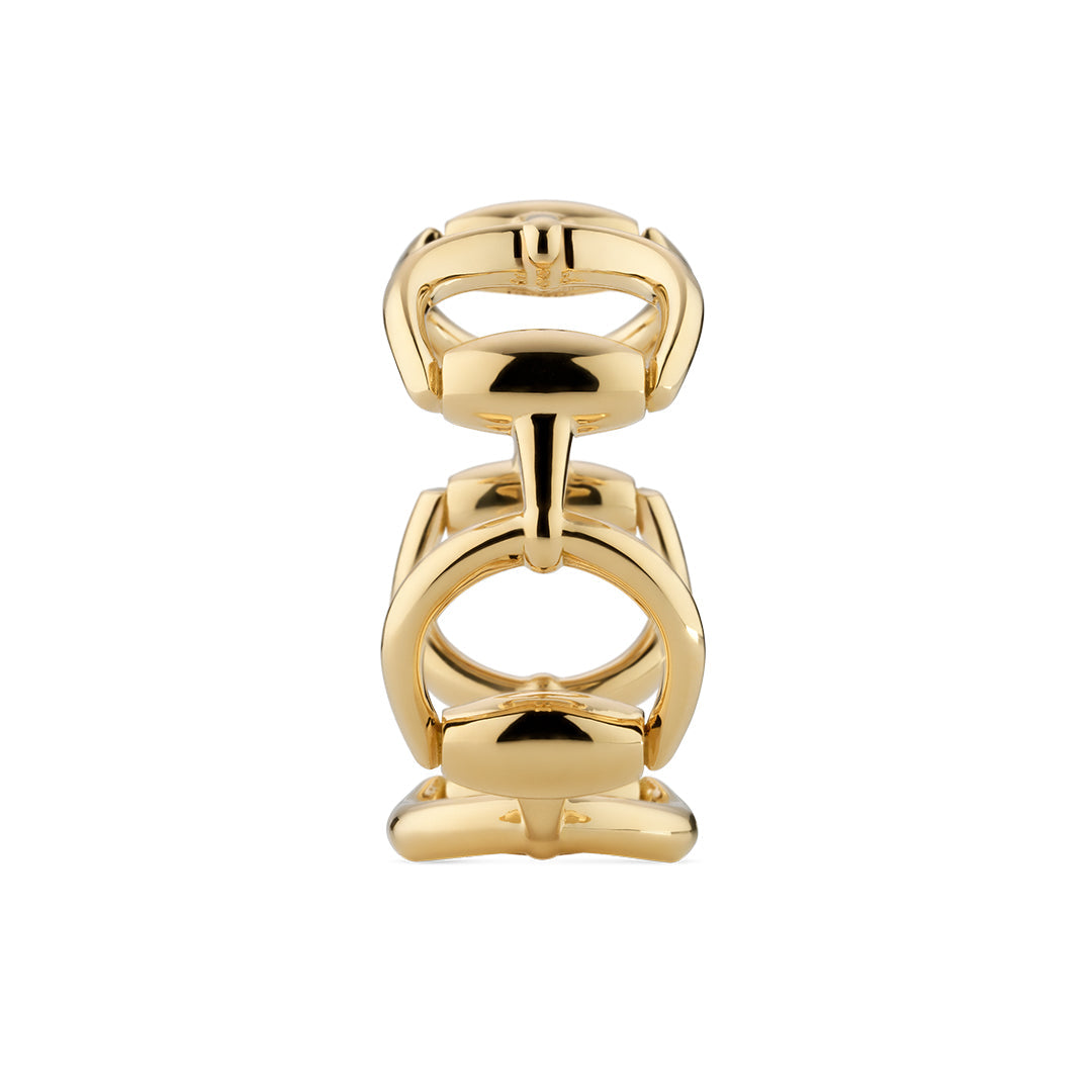 The Gucci Horsebit 18K Yellow Gold Ring by GUCCI Fine Jewellery displays upright horsebit-shaped hardware on a white background, with smooth, interlocking polished gold elements—an iconic detail of the brand’s collections.