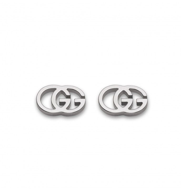 The Gucci Interlocking G 18K White Gold Stud Earrings from GUCCI Fine Jewellery boast an exquisite design with a silver metallic double "G" logo, set against a simple white background. These earrings are certified by the Responsible Jewelry Council for sustainable luxury.