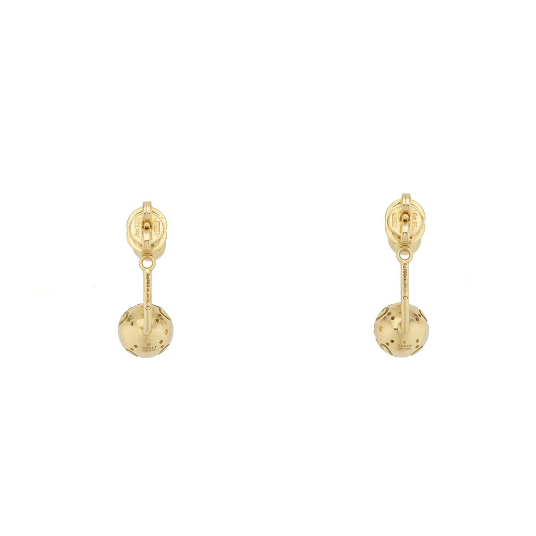 Gucci Icon Boule 18K Yellow Gold Jacket Earrings by GUCCI Fine Jewellery, featuring textured spherical drops, are showcased against a white background.