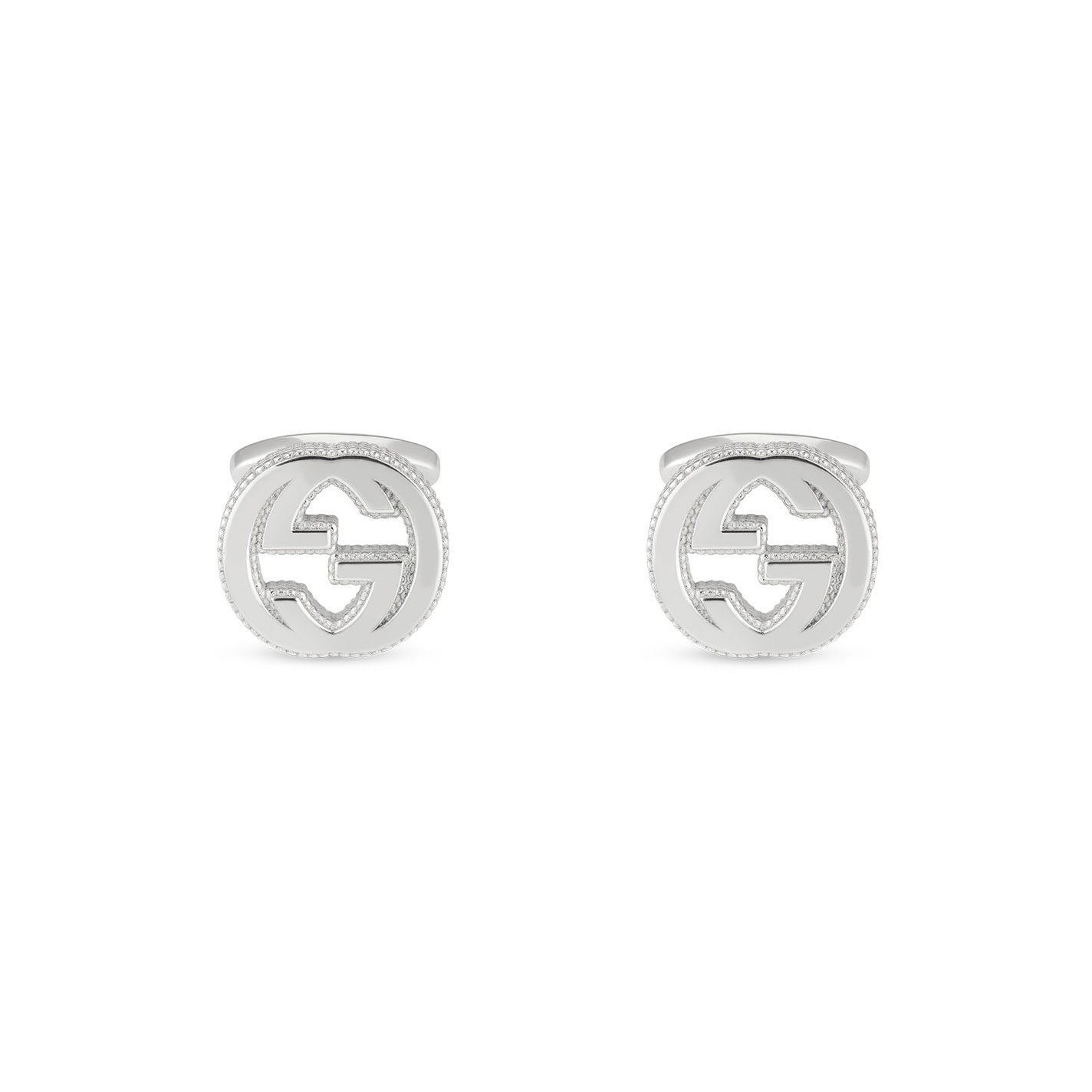 The Gucci Trademark Sterling Silver Cufflinks from GUCCI Gift and Accessories feature a circular design with an intricate geometric pattern. Their smooth, polished surface gleams beautifully, showcasing an elegant and sophisticated charm.