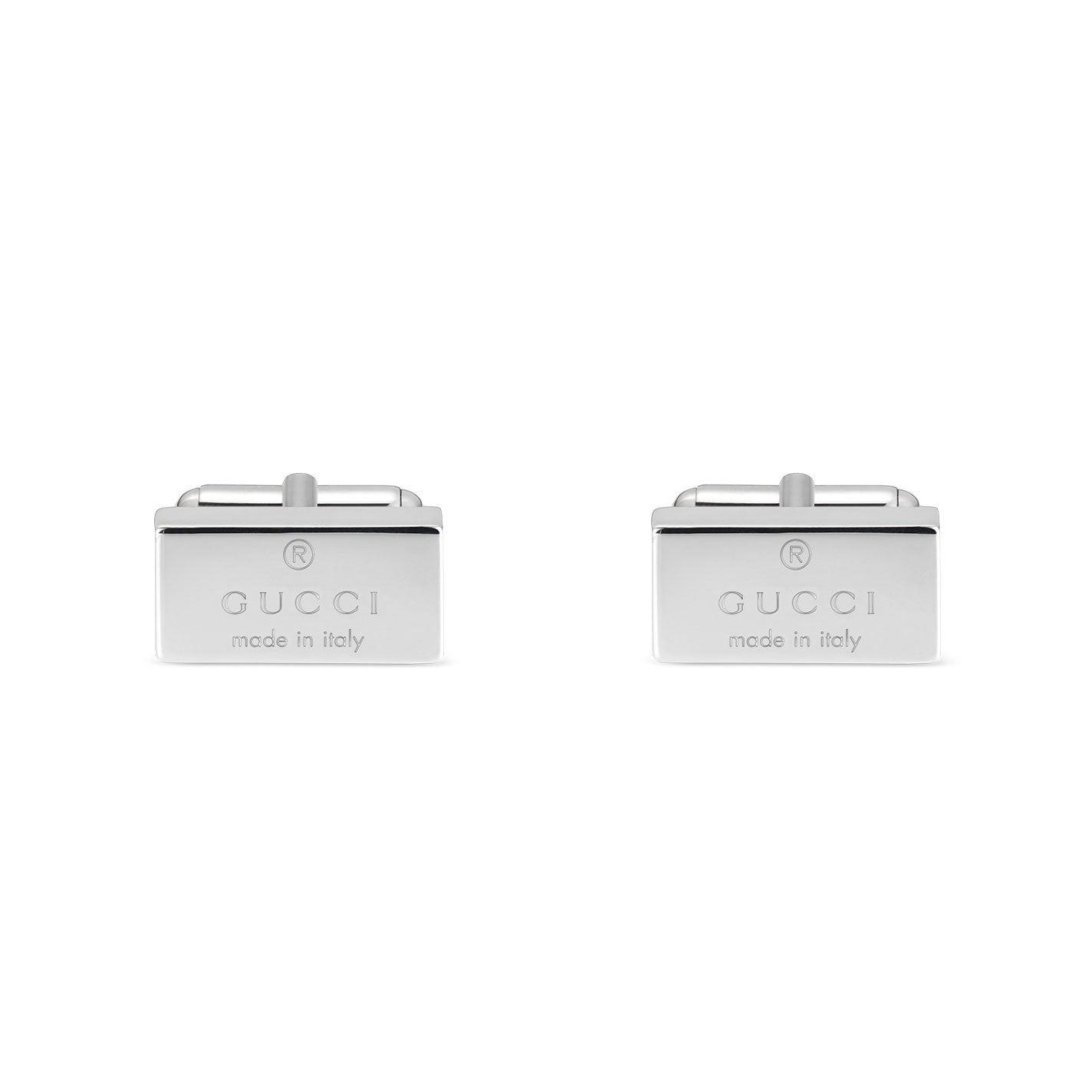 Gucci Trademark Sterling Silver Cufflinks from GUCCI Gift and Accessories exhibit a sleek finish with a minimalist yet elegant design, perfect for adding sophistication to any ensemble. Each rectangular cufflink is engraved with the "GUCCI made in Italy" logo.