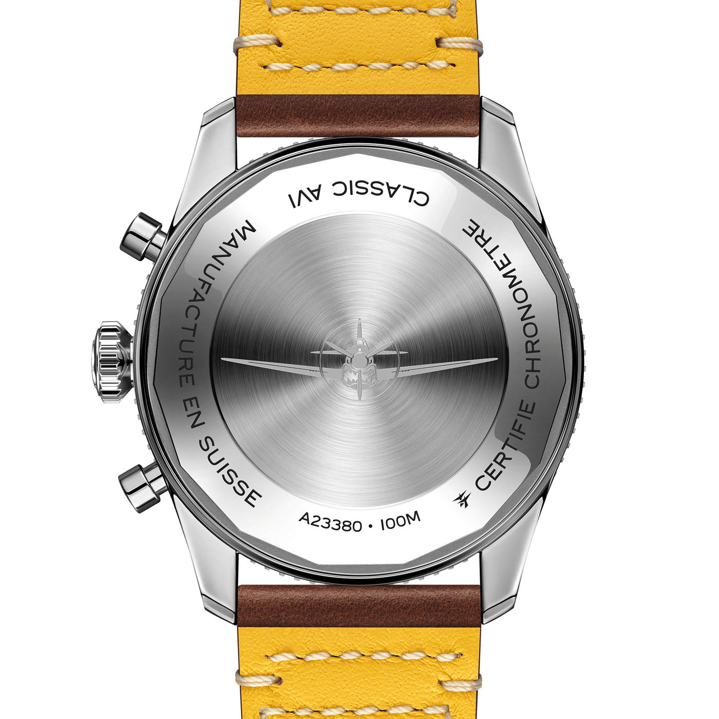 The image showcases the back of a Breitling Classic AVI Chronograph 42 Curtiss Warhawk stainless steel wristwatch. It features engravings of "Classic AVI," "Manufacture En Suisse," and "Certifie Chronometre." Drawing inspiration from the Curtiss P-40 Warhawk, this pilot’s watch is paired with a yellow leather strap with brown edges.