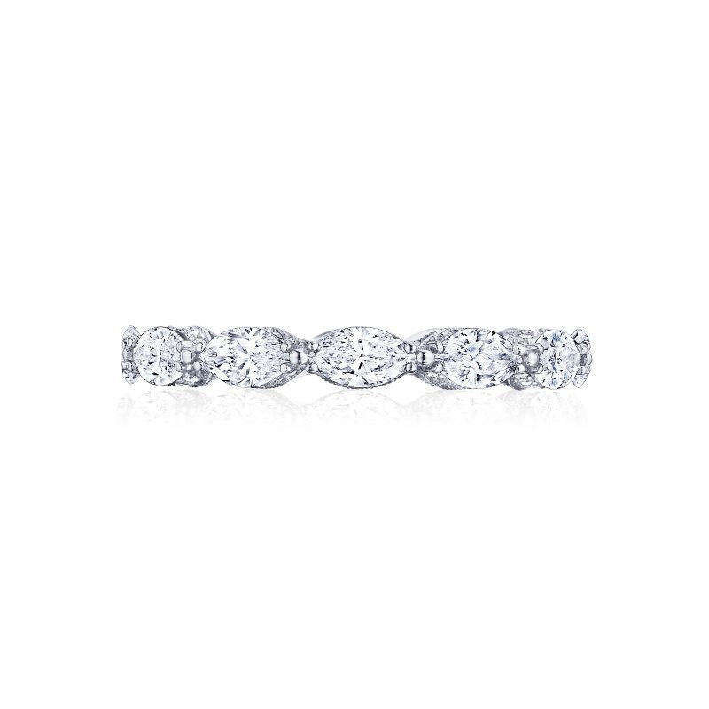 The Tacori Classic Crescent RoyalT 18K White Gold Marquise Cut Pear Diamond Anniversary Ring displays a continuous row of oval, round, and marquise-shaped diamonds that reflect light for a breathtaking shimmer. This delicate band is crafted by Tacori and exemplifies timeless beauty with its elegant, symmetrical design.