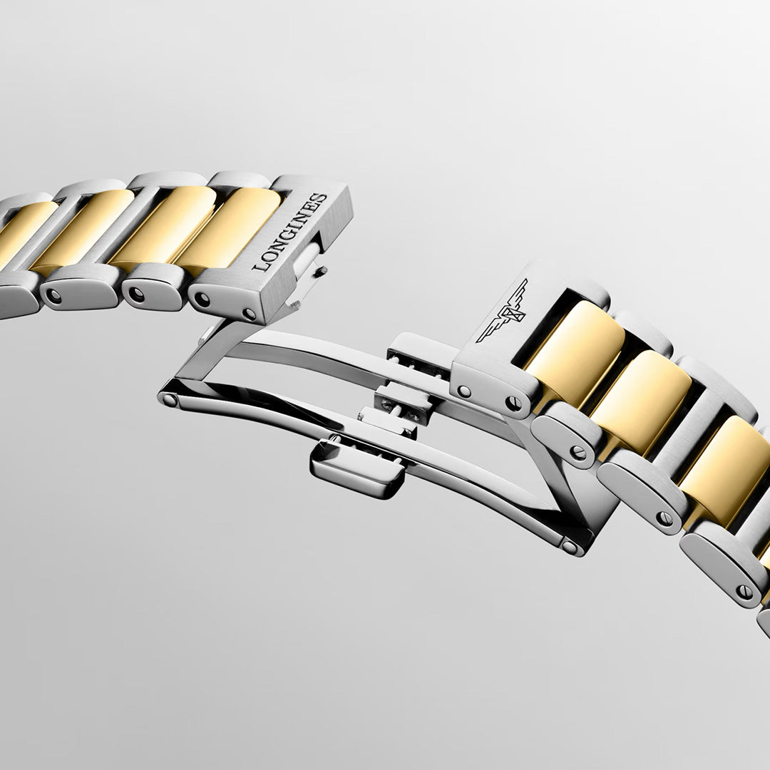 The Longines Conquest Quartz 34mm watch features a two-tone silver and gold link bracelet, shown with the deployment clasp open to reveal its sporty elegance.