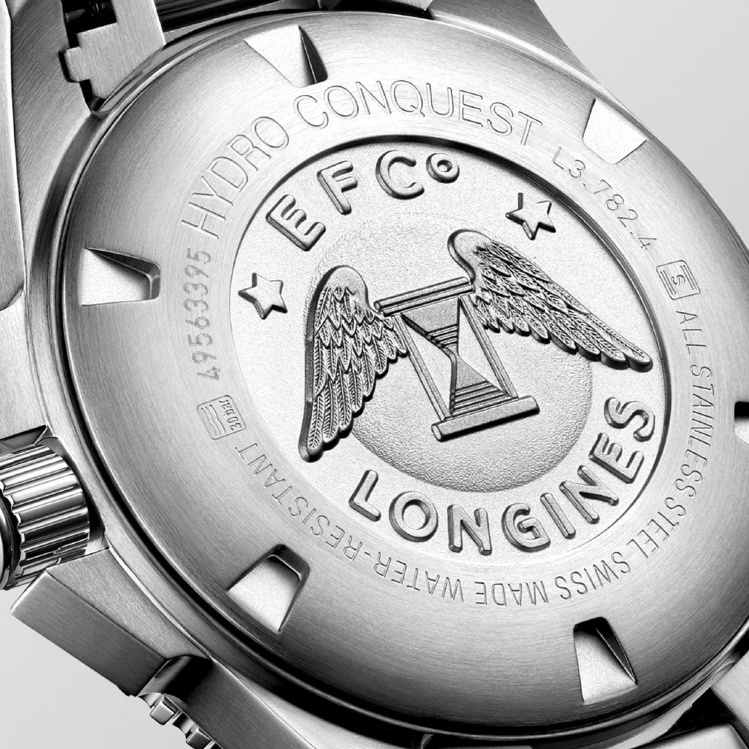 Close-up of the Longines HydroConquest Automatic 43mm’s stainless steel back, featuring engraved text, star motifs, and a winged hourglass emblem, plus its unidirectional rotating bezel and water-resistant design.