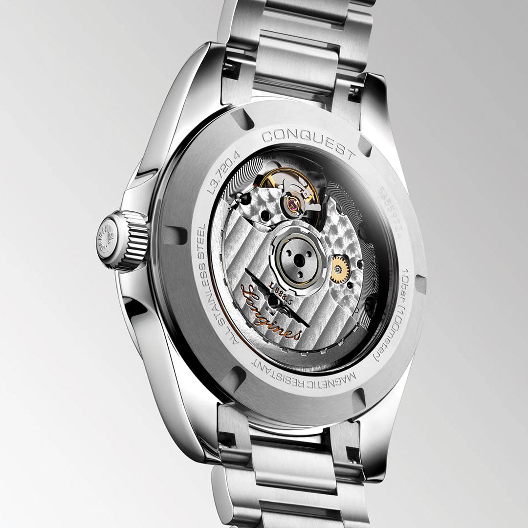Close-up of the Longines Conquest Automatic 38mm shows its Swiss-made mechanical movement through a transparent case back—an elegant choice for everyday wear.