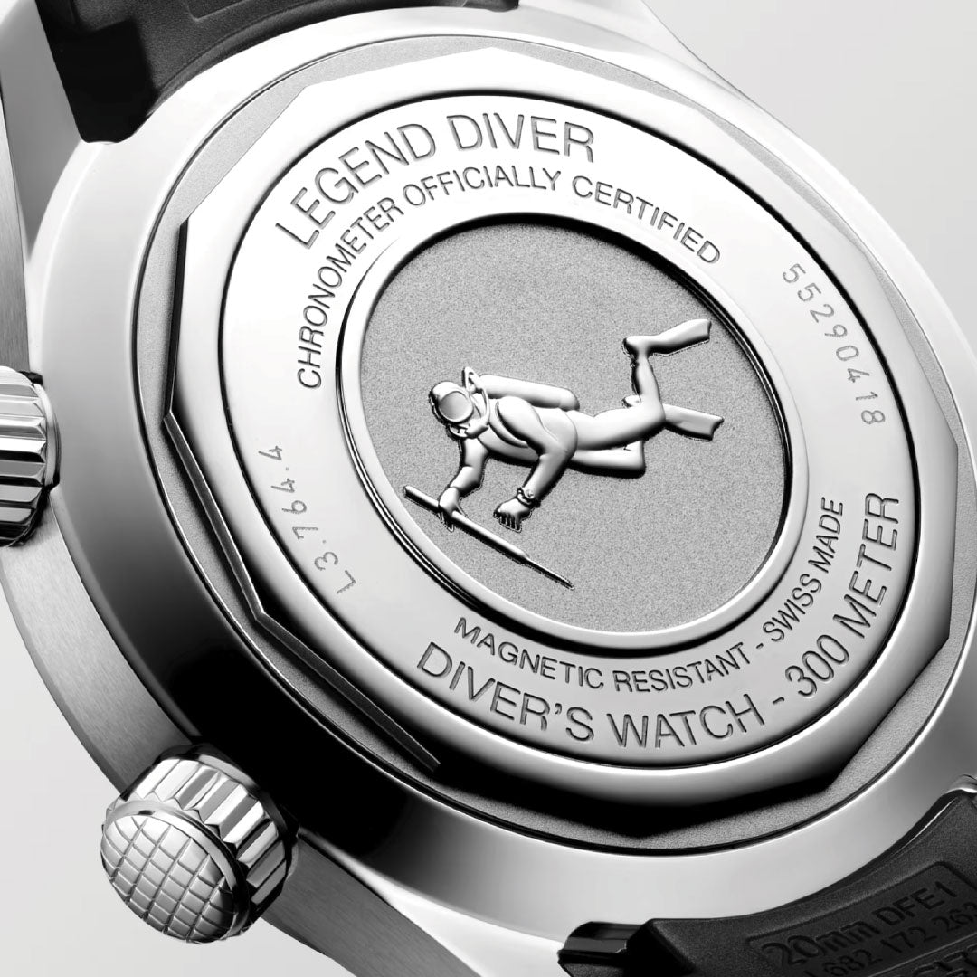 The Longines Legend Diver Automatic 39mm watch features a scuba diver engraving and the inscriptions "Legend Diver," "300 Meter," "Magnetic Resistant," and "Chronometer Officially Certified" on the caseback, plus an internal rotating bezel for precise timing.