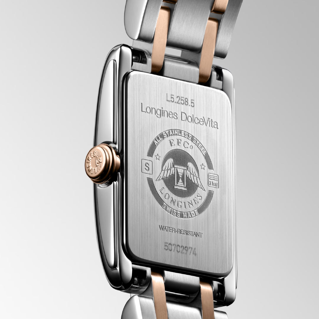 The Longines Dolcevita Quartz 17.70 X 27mm Watch showcases timeless elegance with its stainless steel case and engraved logo. The two-tone bracelet exudes the Italian sweet life, while the visible crown and water-resistance features complete this exquisite piece.